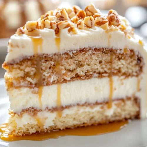 White German chocolate cheesecake slice with nuts and caramel drizzle