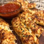 Cheesy Halloween Breadstick Bones with Spooky Marinara Dip